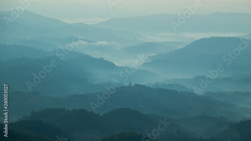 mountains valley with the sea of fog and clouds.Layers of mountains in morning sunrise.
