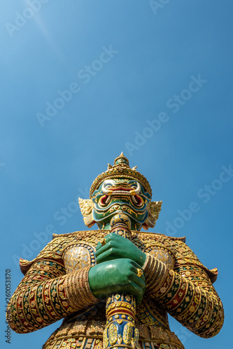The beautiful emerald giant statue on clear blue sky background