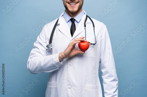 Photos healthcare and medical concept - male doctor with heart.