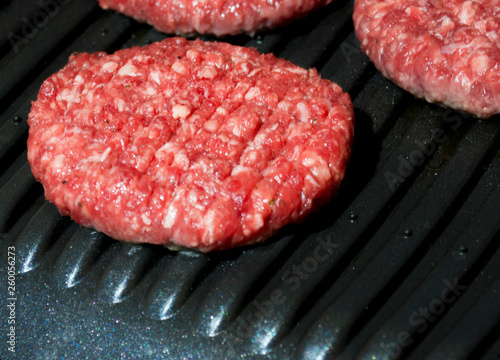 four steaks on an electric grill close up