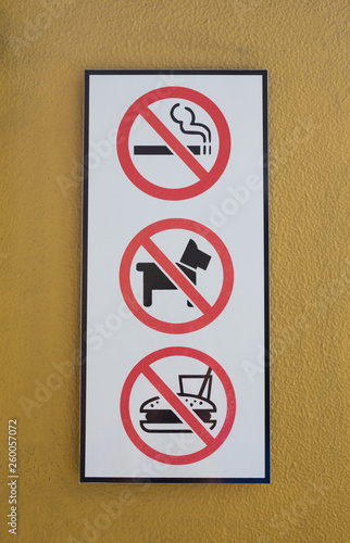 No smoking , dog and food symbol on wall.