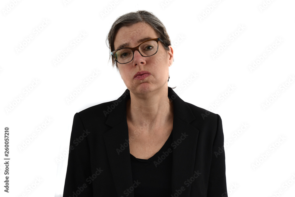 Middle-aged secretary with graying hair and glasses makes a despondent sigh. White background.