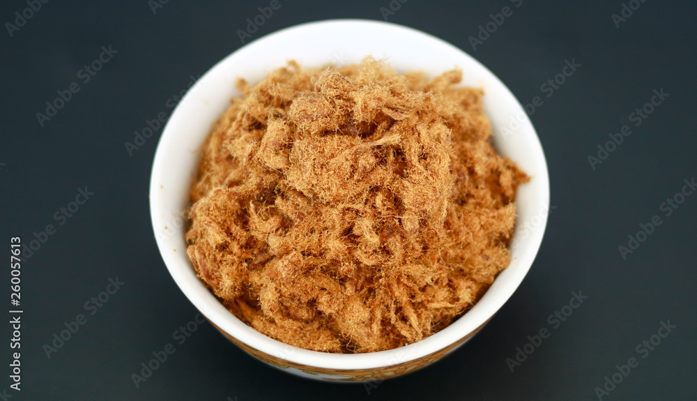 Rousong or beef floss on black background. Rousong or beef floss on black background.