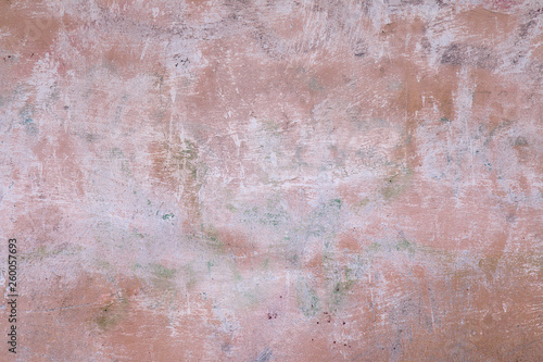 Painted pink old wall with brush marks, urban grunge background for design