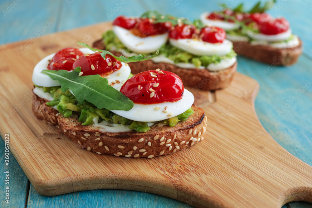 mashed avocado on toast bread with boiling egg cherry tomatoes cream cheese healthy sandwich soft focus mashed avocado on toast bread with boiling egg cherry tomatoes cream cheese healthy sandwich soft focus