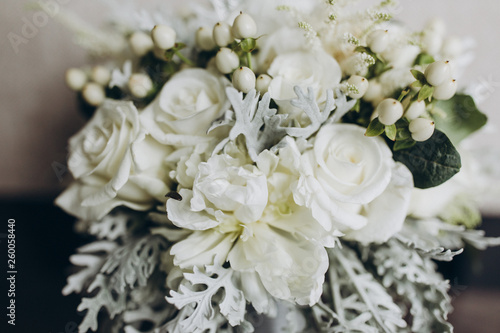 wedding bridal bouquet stands on a gray background