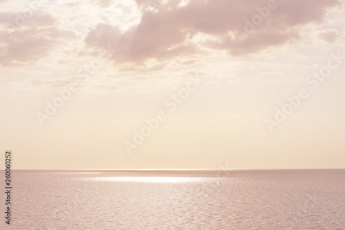 Pink sunset over Mediterranean Sea. Beautiful sunset over calm ocean. Sunrise or sunset over the sea with retro filter effect  summer concept