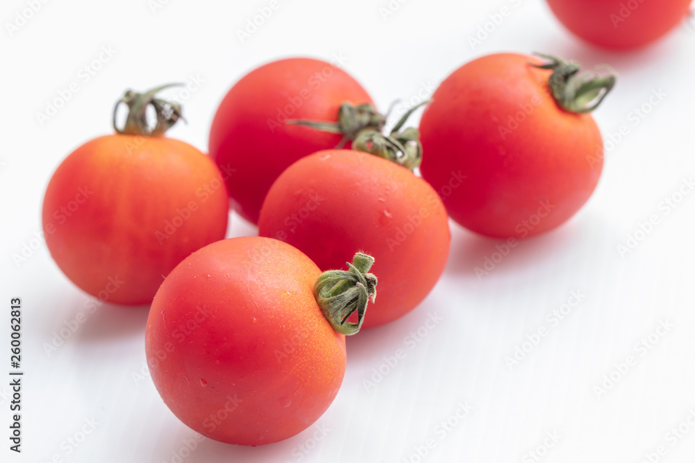 Close up tomatoes on isolate white background.Selective focus red tomatoes. Close up tomatoes on isolate white background.Selective focus red tomatoes.