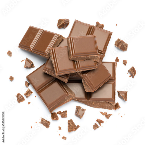 Milk organic chocolate pieces isolated on white background