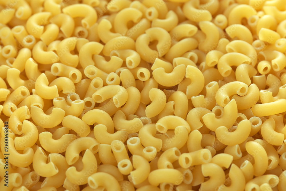 Raw wheat pasta close up Raw wheat pasta close up