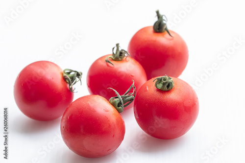  Close up tomatoes on isolate white background.Selective focus red tomatoes.