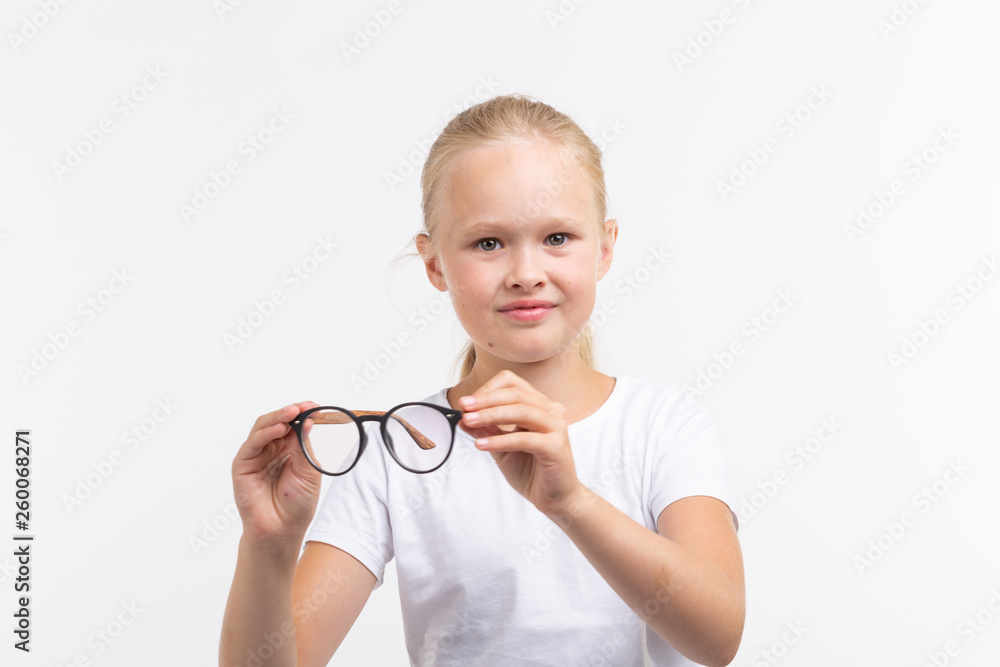 Beautiful child girl with glasses isolated on white Beautiful child girl with glasses isolated on white
