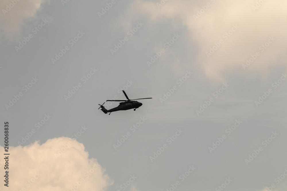 Fototapeta premium Helicopter flying in the sky.