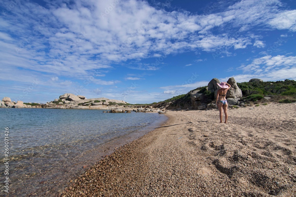 Girl on the La Licciola beach in Sardinia