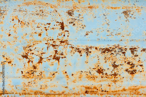 rust covered metal wall,rusty metal texture with blue paint remains