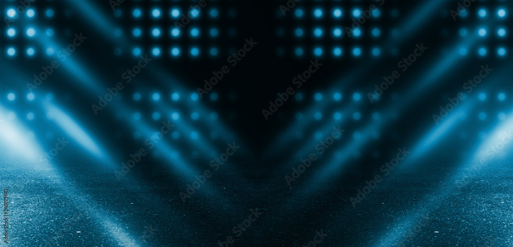 Obraz premium Empty scene background. Dark street, reflection of neon light on wet asphalt. Rays of light in the dark, smoke. Night view of the street, the city. Abstract dark blue background.