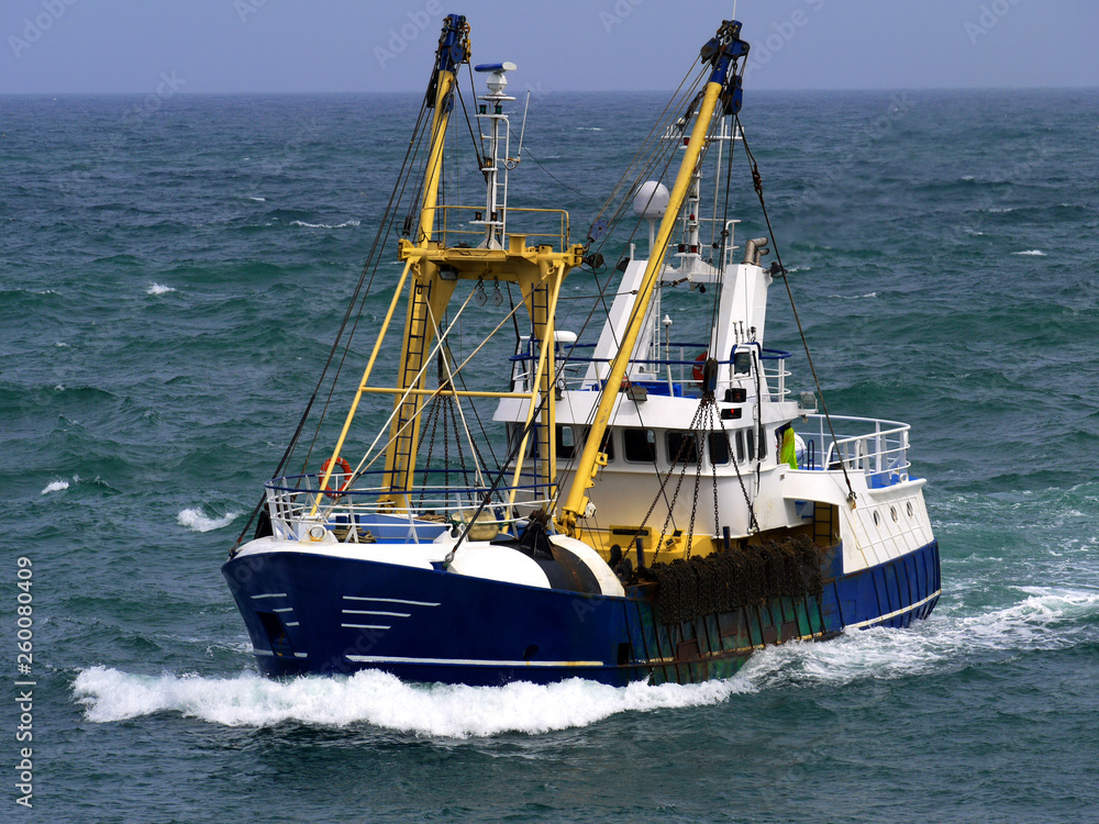 Fishing boat in choppy sea underway to harbour to discharge fish. Fishing boat in choppy sea underway to harbour to discharge fish.