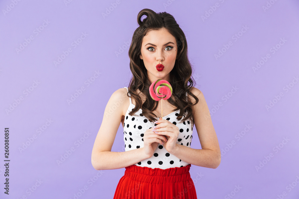 Portrait of a beautiful pin-up girl wearing bright makeup Portrait of a beautiful pin-up girl wearing bright makeup