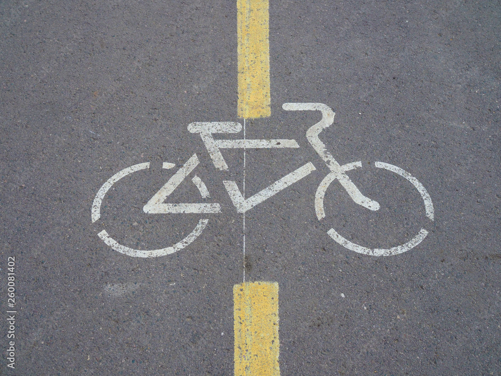 Obraz premium sign Bicycle paths on the gray asphalt on a city street