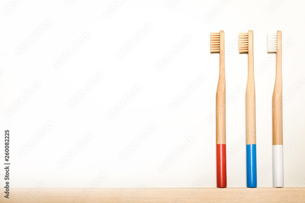 full colours bamboo toothbrushes on white background. Place for text. Ecoproduct.   eco-friendly.