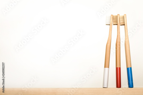 full colours bamboo toothbrushes on white background. Place for text. Ecoproduct. eco-friendly.