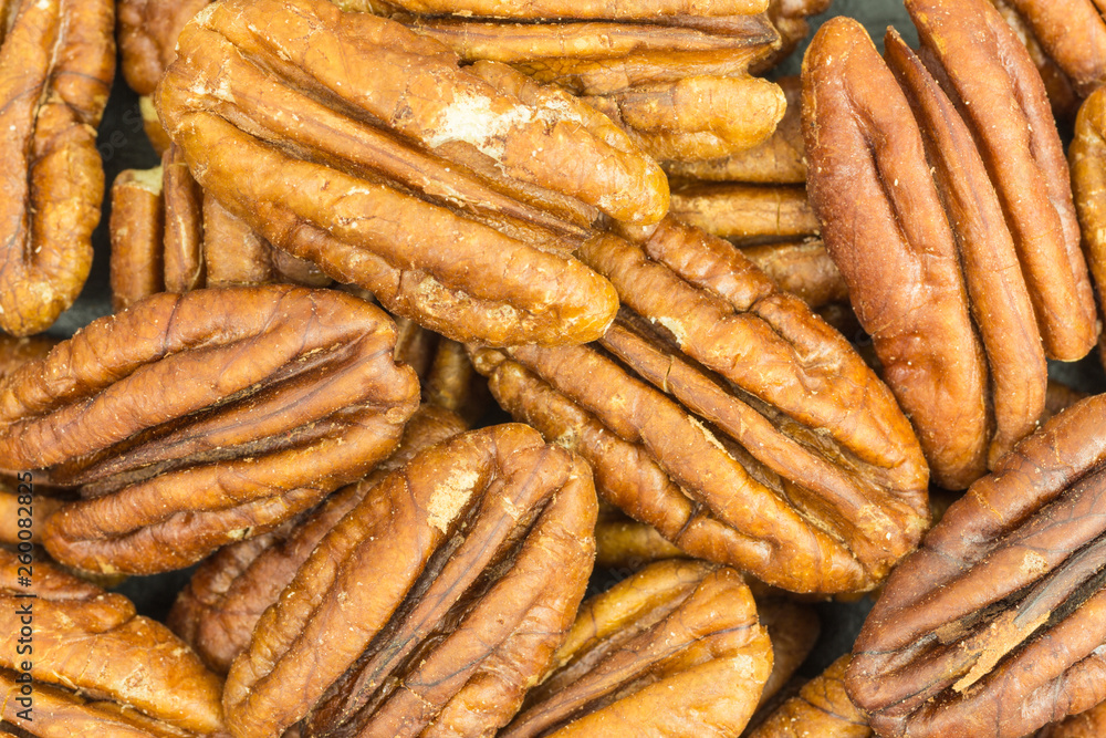 background of pecan nuts - carya illinoinensis background of pecan nuts - carya illinoinensis