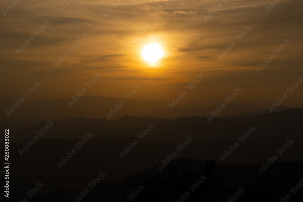 Landscape of sunset over hill and mountain.