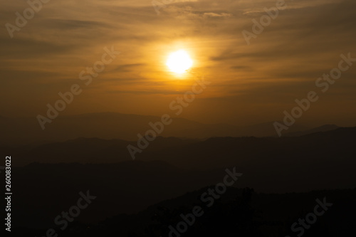 Landscape of sunset over hill and mountain.