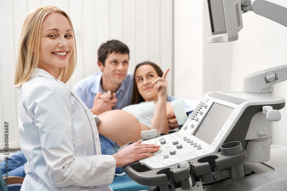 Qualified doctor in process of doing ultrasound diagnostic