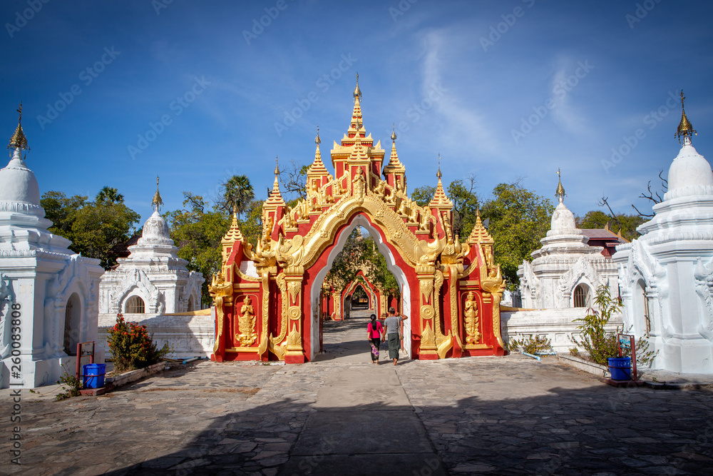 Entrance to the The world biggest book contained in white stupas inscribed on large stones at Kuthodaw Pagoda, Mandalay, Myanmar.