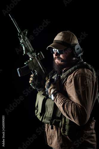 Armed soldier ready for battle. Military concept.
