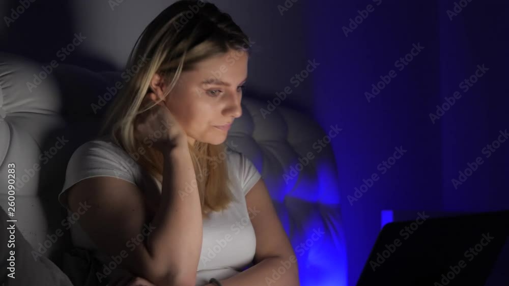 thoughtful girl looks into the laptop thoughtful girl looks into the laptop