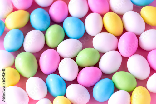 Background Small colorful candy eggs in the stand. Easter celebrate concept. Close up. © alju