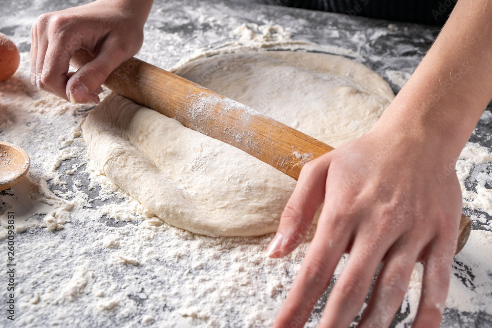Making dough by female hands at bakery Making dough by female hands at bakery