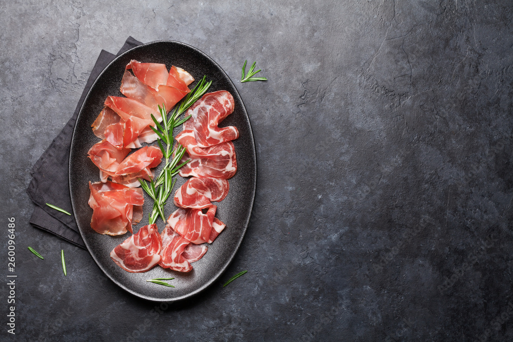 Spanish jamon, prosciutto crudo ham, italian salami Spanish jamon, prosciutto crudo ham, italian salami
