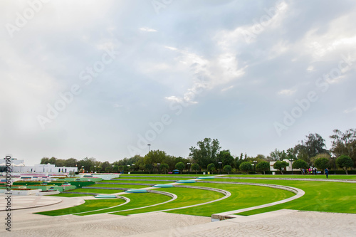 Wallpaper Mural Green lawn area at mamzar park with cloudy sky background Torontodigital.ca