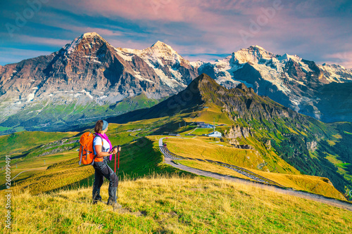 Mannlichen tourist station with backpacker hiker woman, Grindelwald, Switzerland, Europe