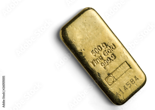 The surface of cast gold bar weighing 500 grams. The texture of the surface of the gold ingot. Isolated on white background.