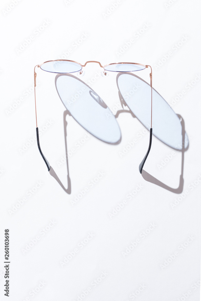 Sunglasses. Eyewear. Sunglasses isolated on a white background. View from above Sunglasses. Eyewear. Sunglasses isolated on a white background. View from above