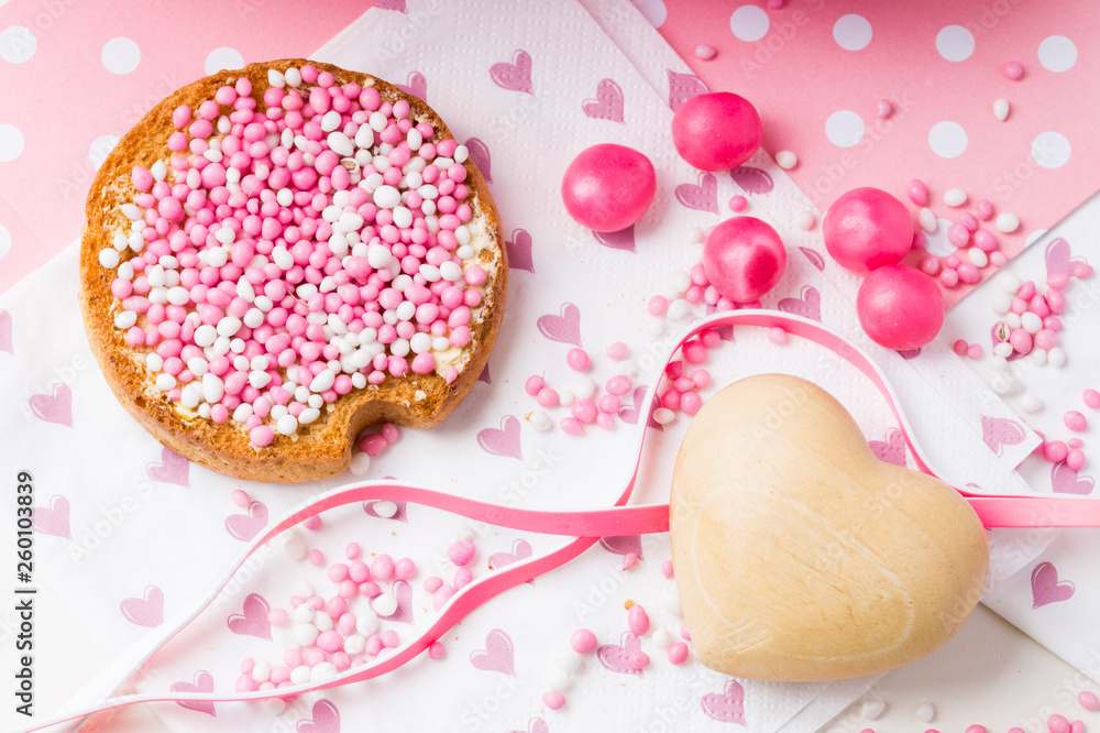 rusk with white and pink aniseed balls, Muisjes, traditional food in The Netherlands when a baby girl is born rusk with white and pink aniseed balls, Muisjes, traditional food in The Netherlands when a baby girl is born