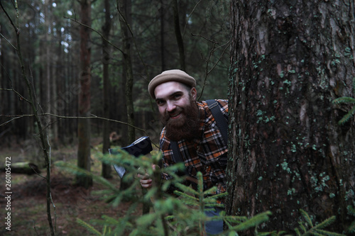 A bearded lumberjack with a large ax