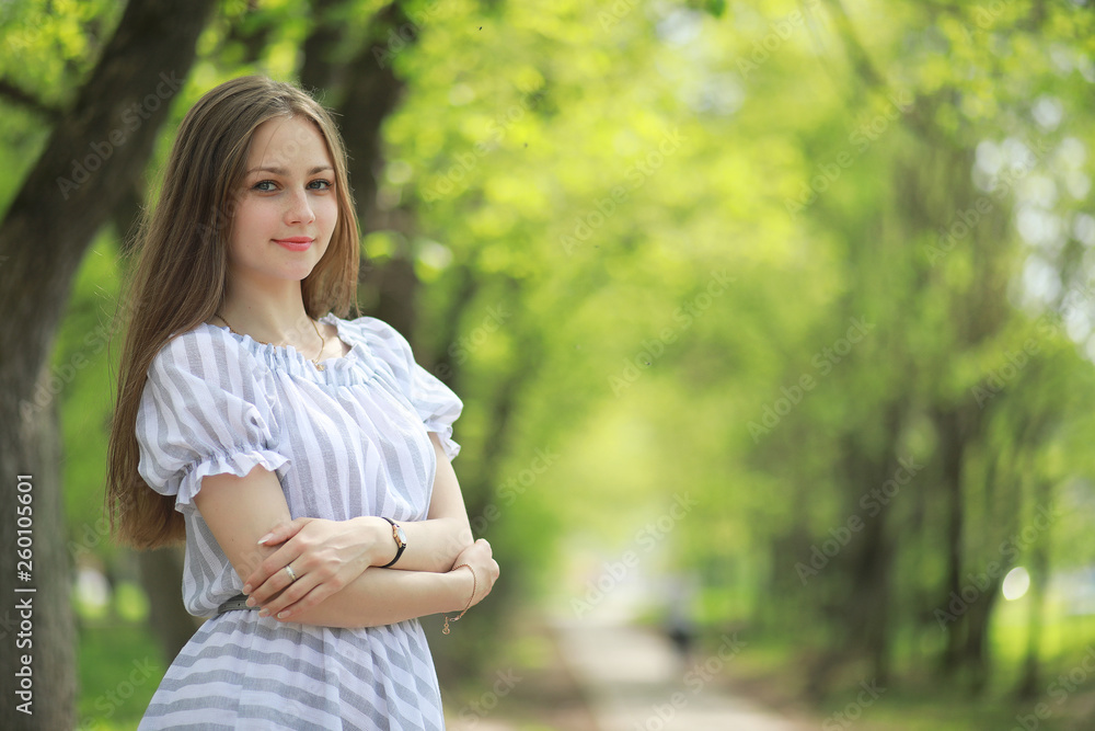 A girl in a spring green park