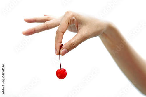 woman hand holding red cherries fruit isolated on white background