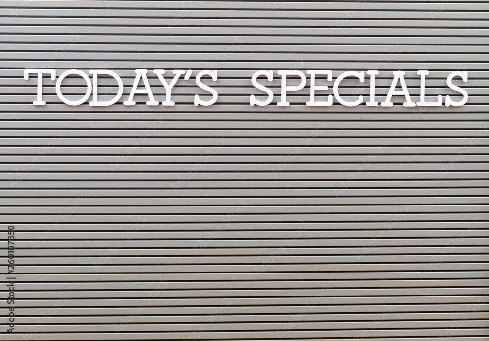 Today's specials written with white plastic letters on grey board with copy space Today's specials written with white plastic letters on grey board with copy space