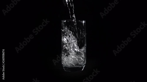 The glass is filled with water