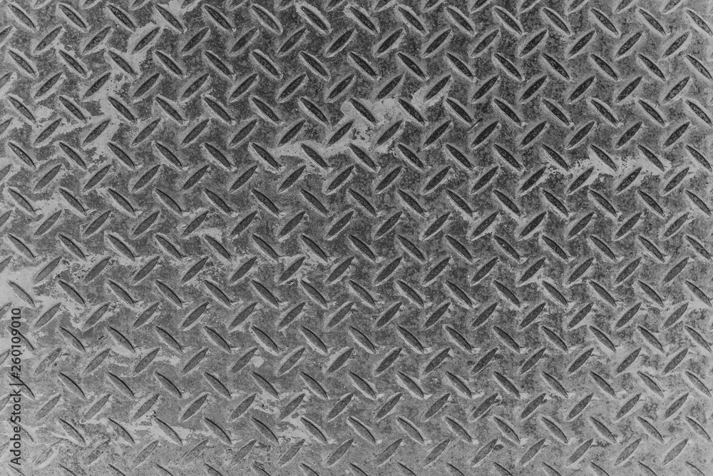 Top view diamond pattern old metal plate surface background and texture. Top view diamond pattern old metal plate surface background and texture.