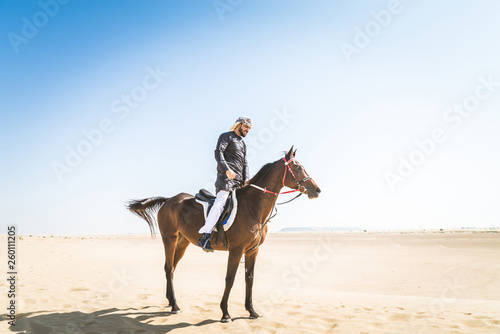 Arabian man with horse in the desert © oneinchpunch