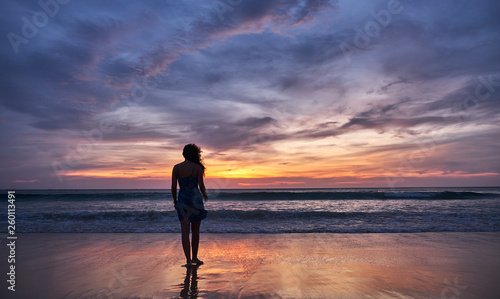 girl at sunset by the sea