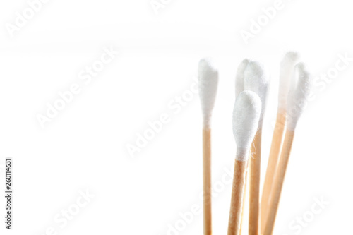 Eco-friendly materials. Wooden, cotton swabs on a white background.