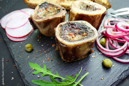 Photos close up of rustic english bone marrow, pickled onion and toast